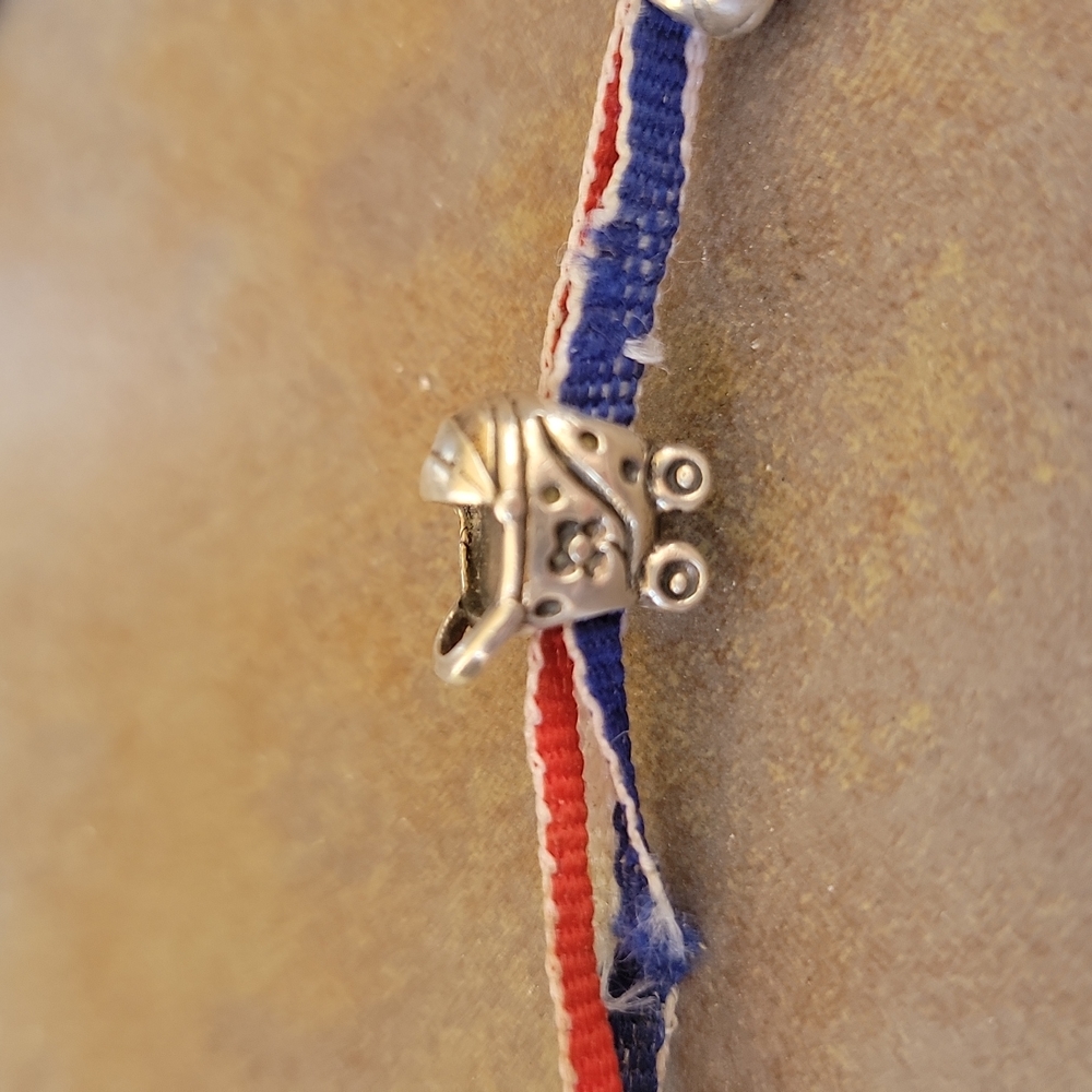 Pandora style baby stroller trollbead (I believe, was a gift). Super cute!